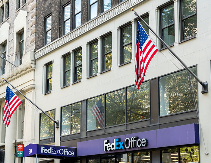 What steps do FedEx workers in Alabama need to take after an accident to receive compensation?