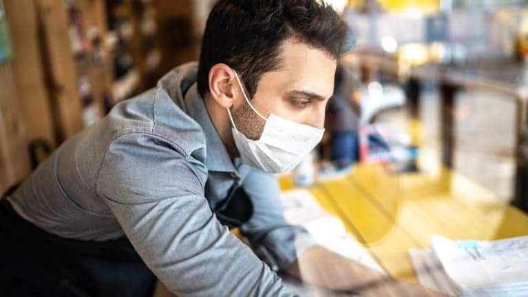 photo of a man wearing a mask during pandemic at work